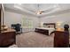 Spacious main bedroom with dark wood furniture, a ceiling fan, and carpeted floor at 1127 East Isle Of Palms Ave., Myrtle Beach, SC 29579