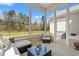 Relaxing screened-in porch with comfortable seating and views of the backyard at 1127 East Isle Of Palms Ave., Myrtle Beach, SC 29579