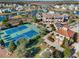 Aerial view of community tennis courts, pools, and clubhouse with manicured landscaping at 1127 East Isle Of Palms Ave., Myrtle Beach, SC 29579
