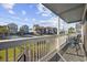 Relaxing balcony showcases the beautiful community views and comfortable seating at 1210 N Ocean Blvd. # 105, Surfside Beach, SC 29575