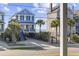 Charming blue beach house with a quaint porch and well-manicured landscaping at 1210 N Ocean Blvd. # 105, Surfside Beach, SC 29575