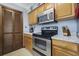 Kitchen with stainless steel appliances and granite countertops, and neutral tones at 1210 N Ocean Blvd. # 105, Surfside Beach, SC 29575