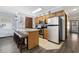 Well-equipped kitchen featuring an island with seating and stainless steel appliances at 1210 N Ocean Blvd. # 105, Surfside Beach, SC 29575