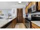 Kitchen with stainless steel appliances, granite countertops, and access to storage at 1210 N Ocean Blvd. # 105, Surfside Beach, SC 29575
