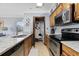 Kitchen with stainless steel appliances, granite countertops, and access to storage at 1210 N Ocean Blvd. # 105, Surfside Beach, SC 29575