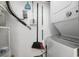 Efficient laundry room with washer, dryer, and wall-mounted utility storage at 1210 N Ocean Blvd. # 105, Surfside Beach, SC 29575