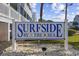 Surfside by the Sea sign with a decorative base and lovely landscaping around it at 1210 N Ocean Blvd. # 105, Surfside Beach, SC 29575