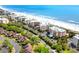 An aerial view shows the condo buildings right on the beautiful beach at 145 S Dunes Dr. # 109, Pawleys Island, SC 29585