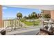 Picturesque balcony view capturing the ocean, beach, and lush landscaping beyond the railing at 145 S Dunes Dr. # 109, Pawleys Island, SC 29585