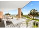 Inviting balcony with seating, views of the ocean, beach, and community pool at 145 S Dunes Dr. # 109, Pawleys Island, SC 29585
