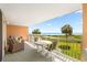 Spacious balcony with comfortable seating and stunning views of the ocean and beachfront at 145 S Dunes Dr. # 109, Pawleys Island, SC 29585