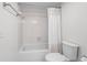 Clean and bright bathroom with a shower-tub combo and neutral tile at 145 S Dunes Dr. # 109, Pawleys Island, SC 29585