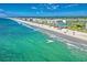 An aerial view shows the beautiful ocean and beach with resort buildings nearby at 145 S Dunes Dr. # 109, Pawleys Island, SC 29585