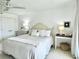 Bright bedroom with white walls, cozy bedding, and tasteful coastal decor at 145 S Dunes Dr. # 109, Pawleys Island, SC 29585