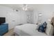 Well-lit bedroom with ample closet space, TV, and access to a bathroom at 145 S Dunes Dr. # 109, Pawleys Island, SC 29585
