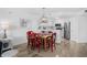 Cozy dining room features a rustic table, stylish pendant lighting, and neutral flooring at 145 S Dunes Dr. # 109, Pawleys Island, SC 29585