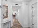 Bright hallway with wood-look floors leads to the dining area and bedroom at 145 S Dunes Dr. # 109, Pawleys Island, SC 29585