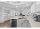 Bright kitchen showcasing stainless steel appliances, quartz countertops, and contemporary fixtures at 145 S Dunes Dr. # 109, Pawleys Island, SC 29585