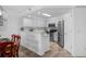 Bright kitchen featuring stainless steel appliances and a convenient breakfast bar with stylish finishes at 145 S Dunes Dr. # 109, Pawleys Island, SC 29585