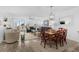 Open-concept living space with access to an outdoor balcony and lots of natural light at 145 S Dunes Dr. # 109, Pawleys Island, SC 29585