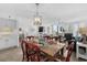 Spacious living area combining dining and lounge, with scenic outdoor views and stylish decor at 145 S Dunes Dr. # 109, Pawleys Island, SC 29585
