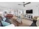 Inviting living space with a comfortable sofa, modern television, dining area, and a spacious layout at 145 S Dunes Dr. # 109, Pawleys Island, SC 29585