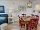 Inviting living space features a rustic dining table with seating, a comfortable sofa and a view at 145 S Dunes Dr. # 109, Pawleys Island, SC 29585