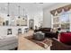 Open living area with a leather sofa, ottoman, access to the kitchen, and large windows at 156 Henry Middleton Blvd., Myrtle Beach, SC 29588