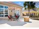 Inviting outdoor patio with comfortable seating, a colorful umbrella, and a charming fire pit at 156 Henry Middleton Blvd., Myrtle Beach, SC 29588