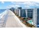 Stunning aerial view of a beachfront resort with ocean views, a sandy beach, and multiple high-rise buildings at 161 Seawatch Dr. # 410, Myrtle Beach, SC 29572