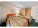Comfortable bedroom showcasing two beds with striped bedspreads and neutral colored walls at 161 Seawatch Dr. # 410, Myrtle Beach, SC 29572