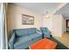 Cozy living room with a blue sofa, chair, and wooden table at 161 Seawatch Dr. # 410, Myrtle Beach, SC 29572