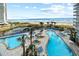 Beautiful resort pool area with multiple pools, hot tubs, and lounge chairs overlooking the ocean at 161 Seawatch Dr. # 410, Myrtle Beach, SC 29572