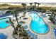 Attractive pool area with multiple pools, hot tubs, lounge chairs, and palm trees, creating a resort-like experience at 161 Seawatch Dr. # 410, Myrtle Beach, SC 29572