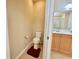 Half bath with toilet and vanity and sink, conveniently located next to the main bathroom at 1612 Fairforest Ct., Conway, SC 29526