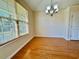 Cozy dining area featuring hardwood floors, modern lighting, and large window at 1612 Fairforest Ct., Conway, SC 29526