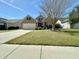 Charming brick home with manicured lawn, mature tree, and inviting curb appeal at 1612 Fairforest Ct., Conway, SC 29526
