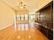 Spacious living room featuring hardwood floors, large windows, and a built-in media center at 1612 Fairforest Ct., Conway, SC 29526