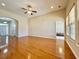 Bright living room featuring hardwood floors, an arched entry, and natural light at 1612 Fairforest Ct., Conway, SC 29526
