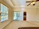 Spacious main bedroom with tray ceilings, ceiling fan, and access to backyard at 1612 Fairforest Ct., Conway, SC 29526
