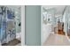 Bathroom with seashell-themed shower curtain, white cabinets, and updated fixtures at 1631 27Th Ave. N, North Myrtle Beach, SC 29582