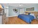 Comfortable bedroom with light blue walls, light wood floors, and coastal decor at 1631 27Th Ave. N, North Myrtle Beach, SC 29582