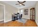Cozy bedroom features light walls, wood floors, ceiling fan, and ample desk space at 1631 27Th Ave. N, North Myrtle Beach, SC 29582