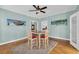Bright dining area features a glass top table set on a plush rug and coastal themed decor at 1631 27Th Ave. N, North Myrtle Beach, SC 29582