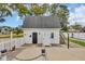 Detached garage with outdoor stair access and a well-manicured lawn and picket fence at 1631 27Th Ave. N, North Myrtle Beach, SC 29582