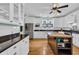 Bright kitchen featuring white cabinets, granite countertops, and a wooden kitchen island at 1631 27Th Ave. N, North Myrtle Beach, SC 29582