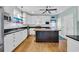 Modern kitchen featuring white cabinetry, stainless steel appliances, and a center island at 1631 27Th Ave. N, North Myrtle Beach, SC 29582