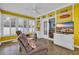 Spacious sunroom features built-in shelves, comfortable seating, and large windows with plantation shutters at 1631 27Th Ave. N, North Myrtle Beach, SC 29582