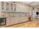 Convenient bar area with ample storage, a sink, and a wine refrigerator, perfect for entertaining at 1644 South Waccamaw Dr., Murrells Inlet, SC 29576