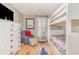 Bright bedroom features a bunk bed, white wooden floors, neutral colors and unique decor at 1644 South Waccamaw Dr., Murrells Inlet, SC 29576